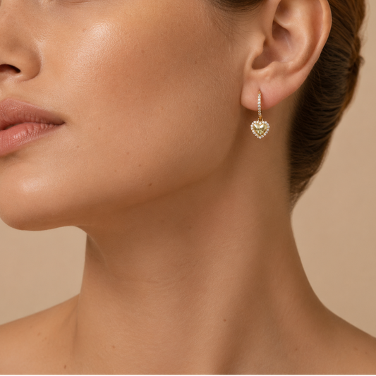 Quiet Heart Earrings worn on the ear in gold finish