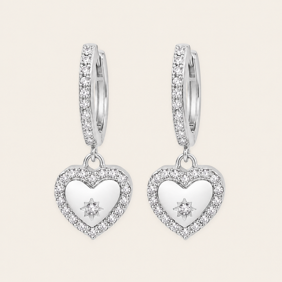 Quiet Heart Earrings with heart-shaped charms on small hoops in silver finish