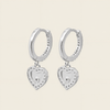 Quiet Heart Earrings with heart-shaped charms on small hoops in silver finish