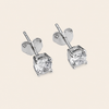 Quiet Light Earrings with clear cushion-shaped stud settings in silver finish