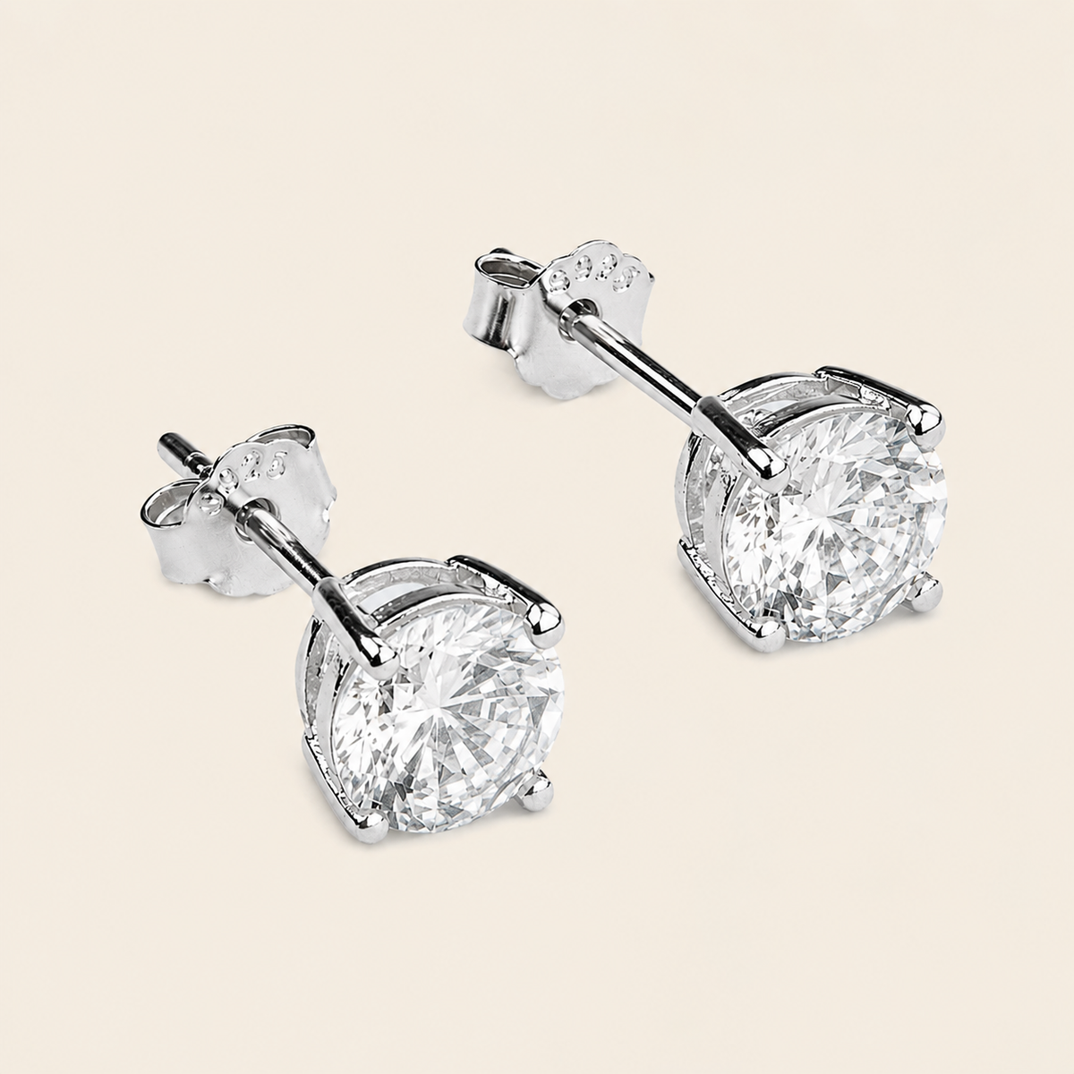Quiet Light Earrings with clear cushion-shaped stud settings in silver finish