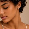 Quiet Light Earrings worn on the ear in silver finish