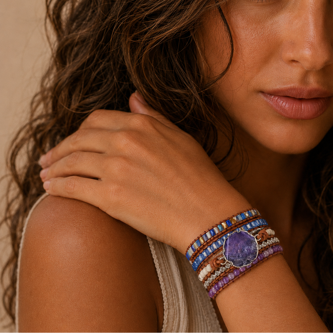 Quiet Pulse Bracelet worn on the wrist, with layered purple, blue and pale beads