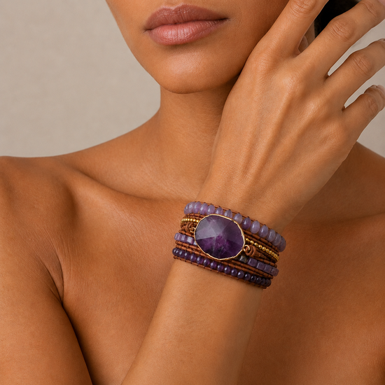 Quiet Violet Bracelet worn on the wrist, with layered purple and pale stone beads