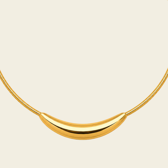 Sculpted Arc Necklace with a fine collar with a sculpted curved centre in gold finish