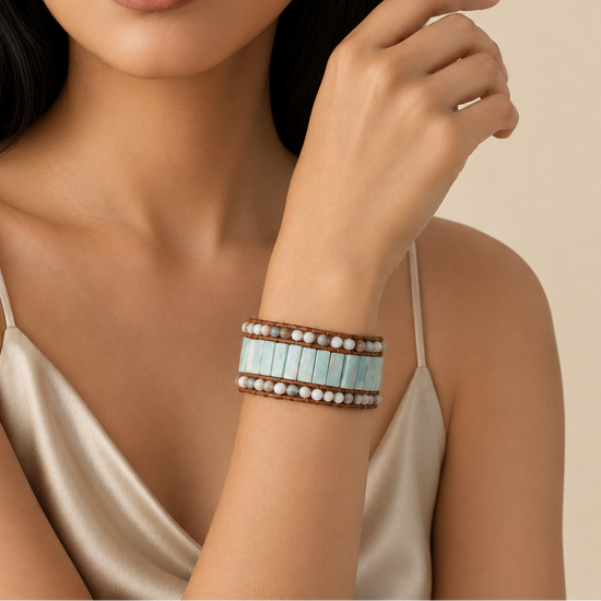 Sealine Tile Bracelet worn on the wrist, with pale blue tiles and round beads on brown cord