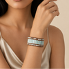 Sealine Tile Bracelet worn on the wrist, with pale blue tiles and round beads on brown cord
