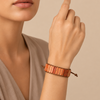 Sedona Ember Bracelet worn on the wrist, with orange patterned stone tiles