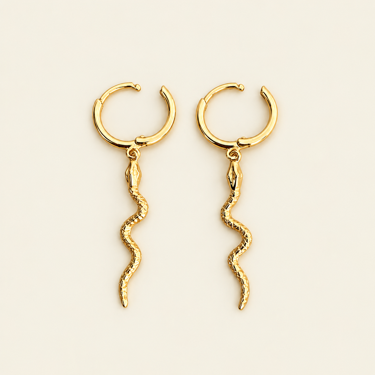 Serpent Drop Earrings with slender snake-shaped charms on small hoops in gold finish