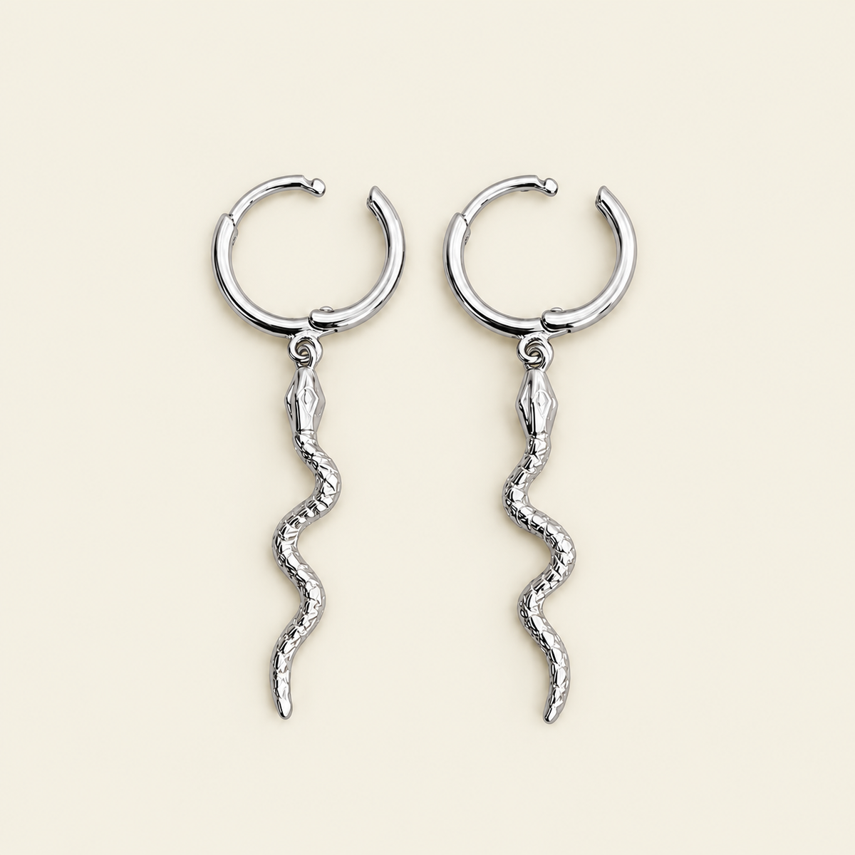 Serpent Drop Earrings with slender snake-shaped charms on small hoops in silver finish