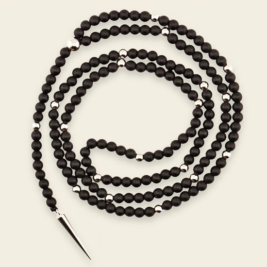 Shadow Point Necklace with small stone beads and a slim pointed pendant