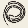 Shadow Point Necklace with small stone beads and a slim pointed pendant