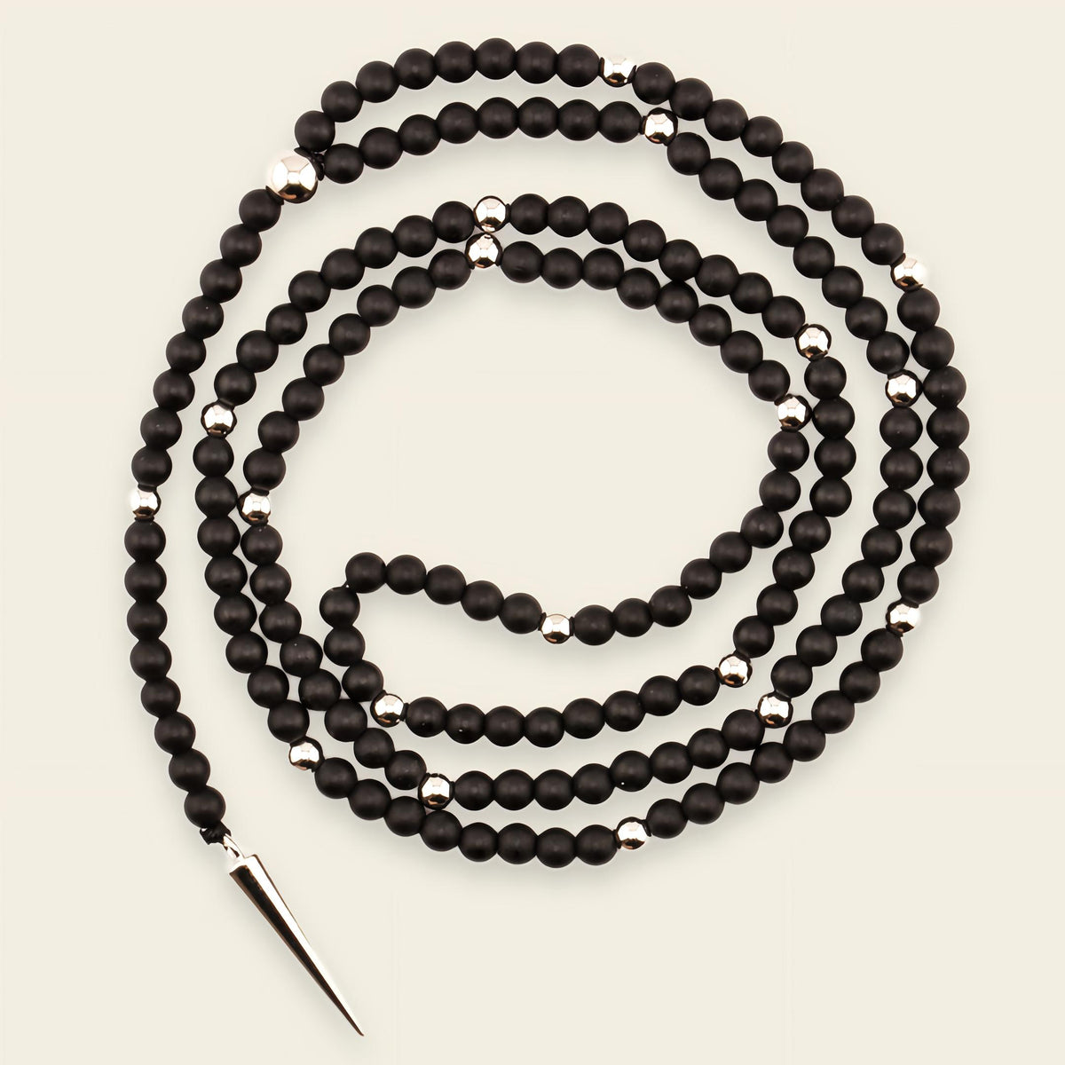 Shadow Point Necklace with small stone beads and a slim pointed pendant