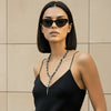 Shadow Point Necklace worn at the neckline, with small stone beads and a slim pointed pendant