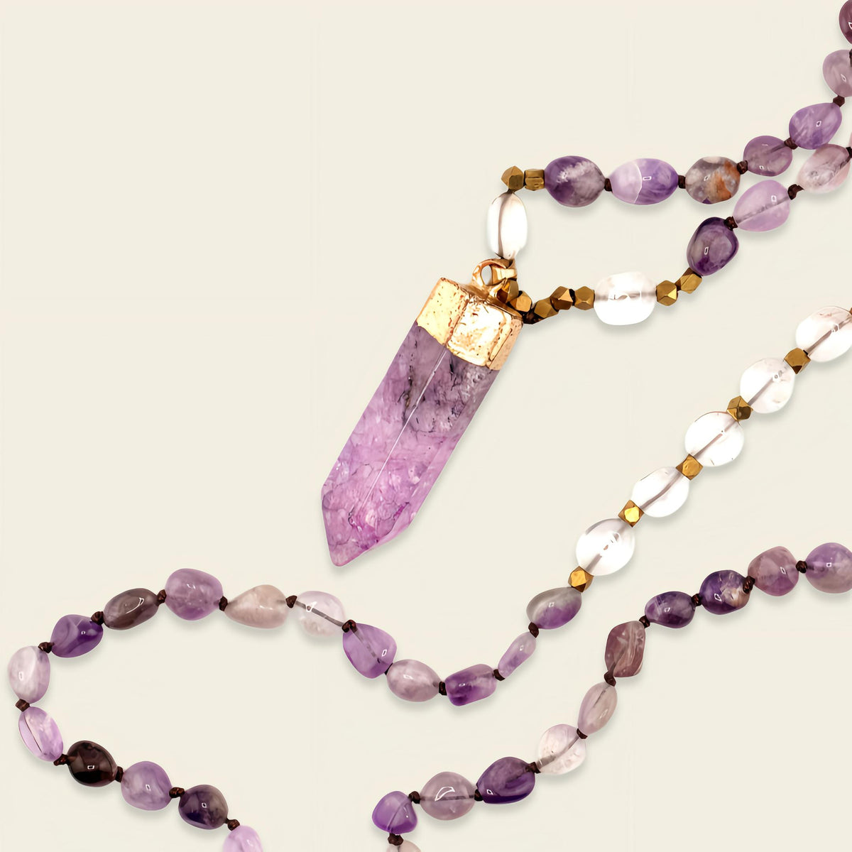 Signal Drift Necklace with purple beads and a pointed purple pendant