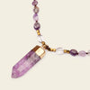 Signal Drift Necklace with purple beads and a pointed purple pendant