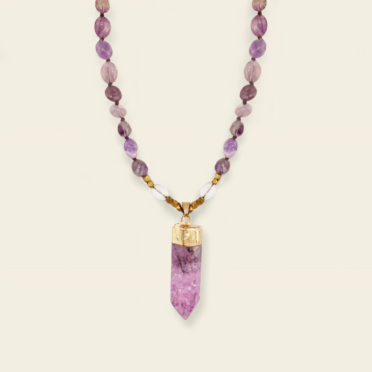 Signal Drift Necklace with purple beads and a pointed purple pendant