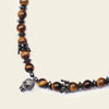 Skull Drift Necklace with round stone beads and skull-shaped accents