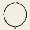 Skull Drift Necklace with round stone beads and skull-shaped accents