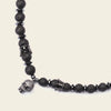 Skull Drift Necklace with round stone beads and skull-shaped accents