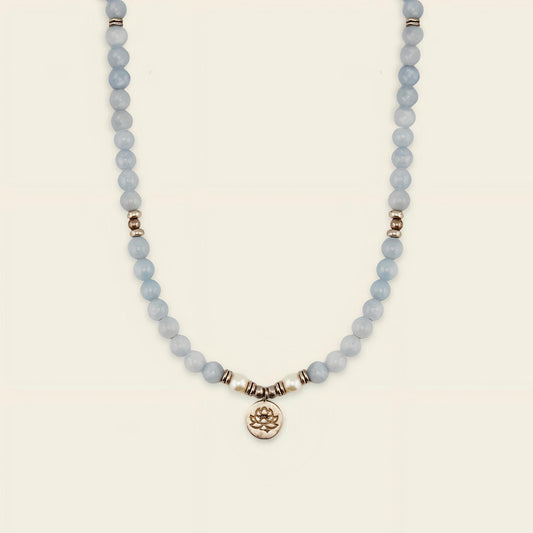 Sky Lotus Necklace with pale blue beads and a small round charm
