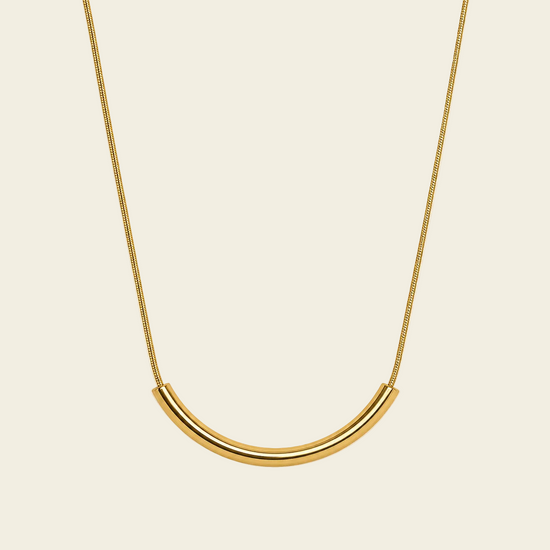 Slender Arc Necklace with a fine chain and slender curved bar in gold finish