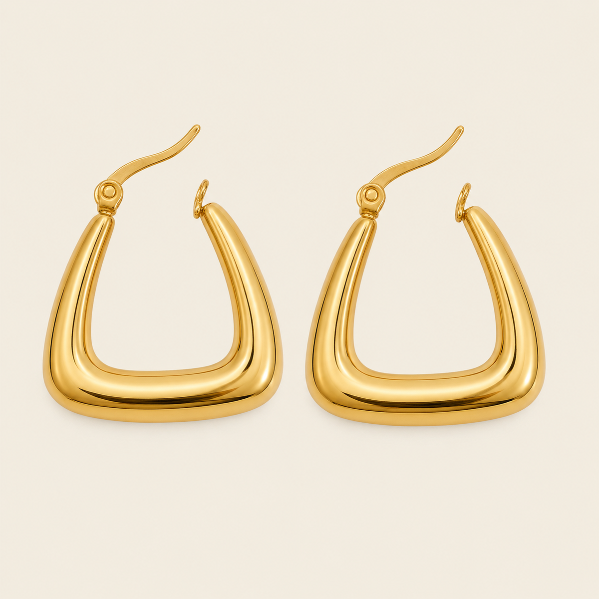 Soft Angle Earrings with polished rounded triangular hoops in gold finish