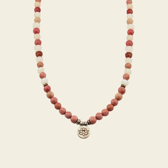 Soft Bloom Necklace with pink round stone beads and a small round charm