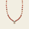 Soft Bloom Necklace with pink round stone beads and a small round charm