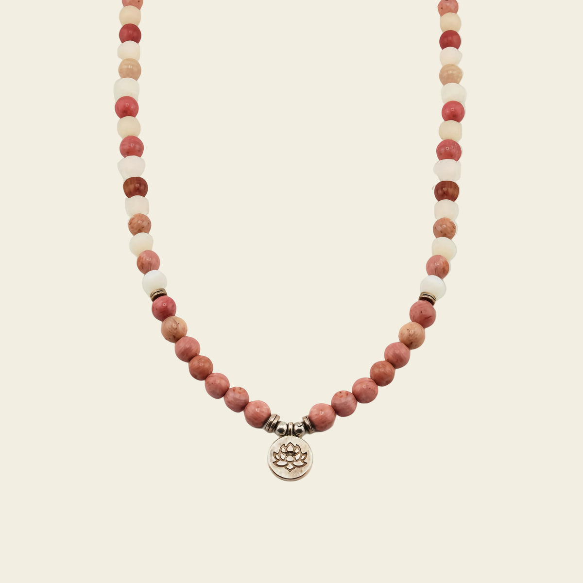 Soft Bloom Necklace with pink round stone beads and a small round charm
