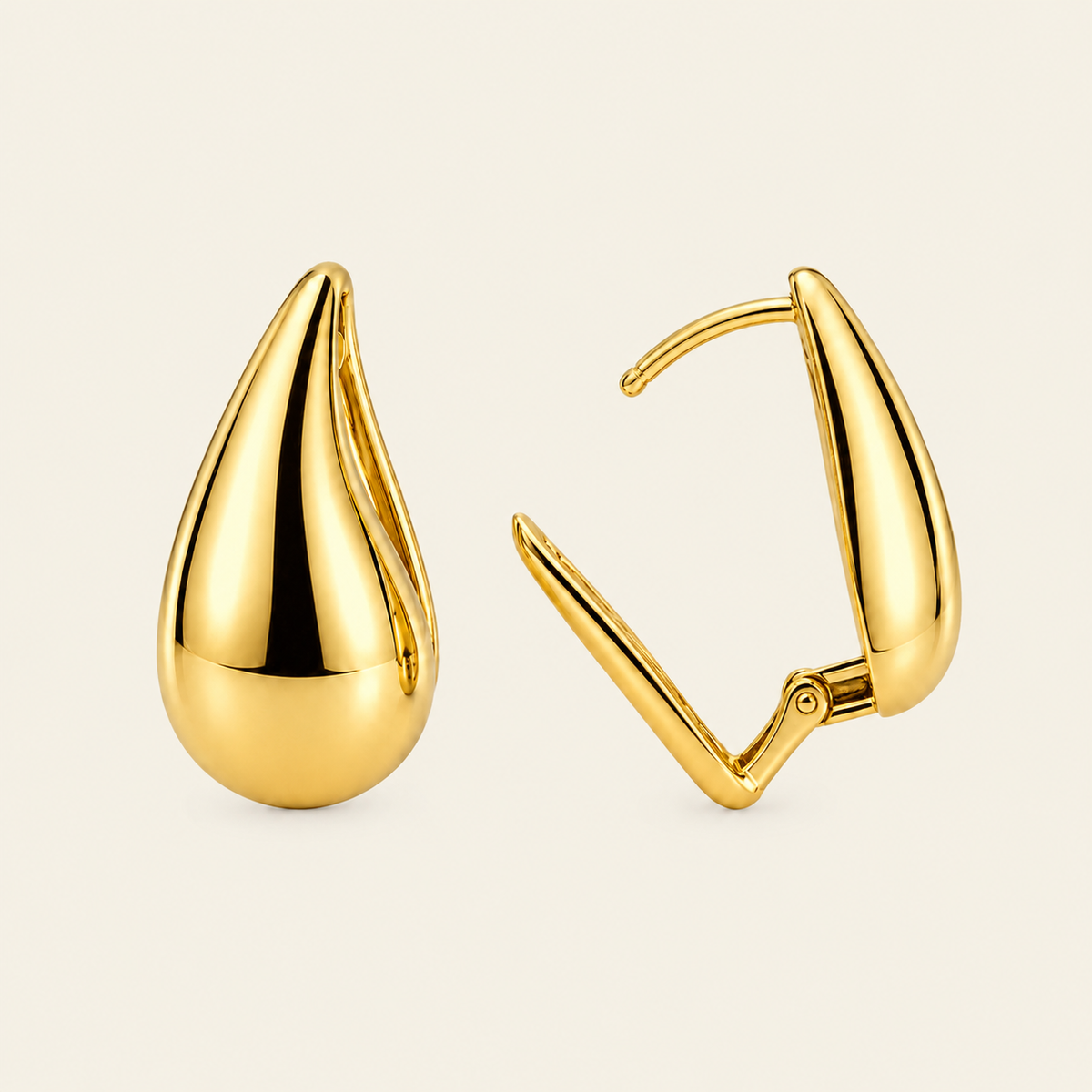 Soft Curve Earrings with polished teardrop-shaped earrings in gold finish