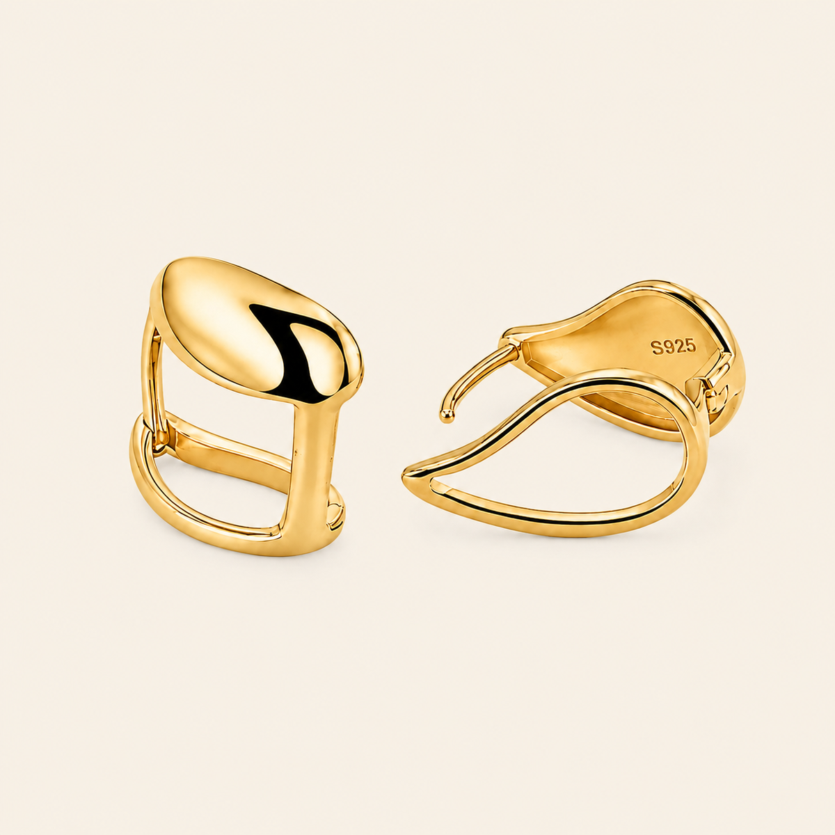 Soft Curve Earrings with polished teardrop-shaped earrings in gold finish
