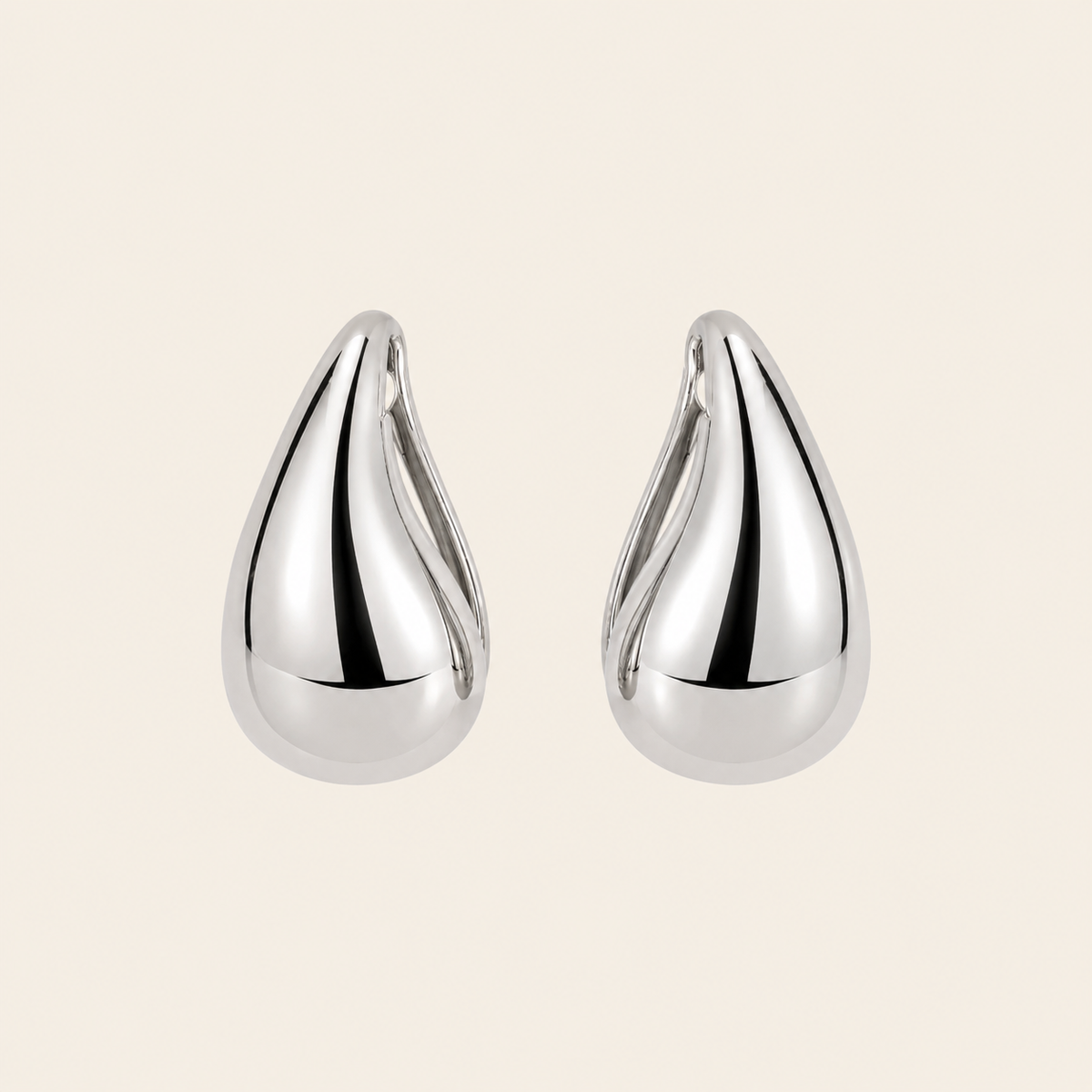 Soft Curve Earrings with polished teardrop-shaped earrings in silver finish