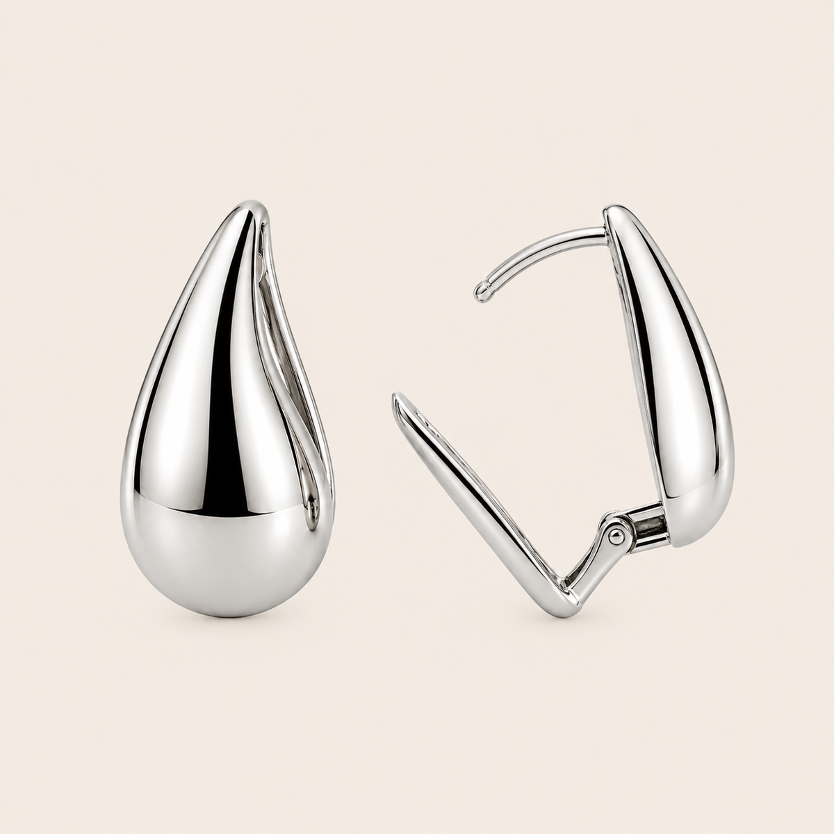 Soft Curve Earrings with polished teardrop-shaped earrings in silver finish
