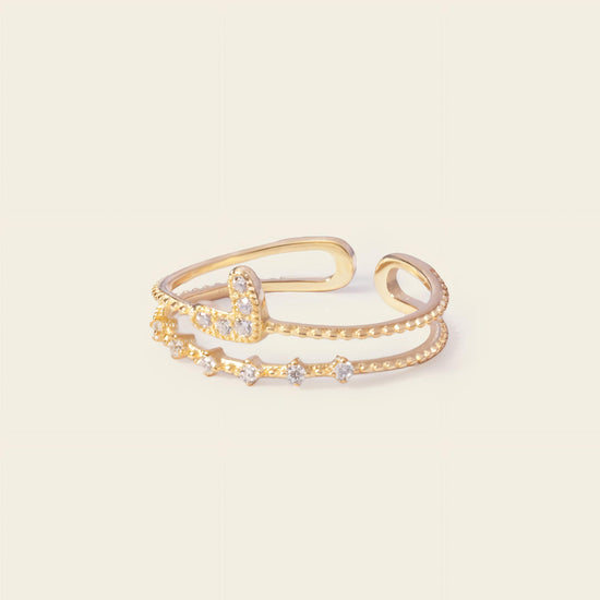 Soft Heart Ring with an open heart-shaped band with clear accents in gold finish