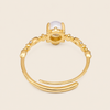 Soft Moon Ring with a pale blue round centre stone and small floral accents in gold finish