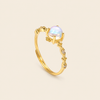 Soft Moon Ring with a pale blue round centre stone and small floral accents in gold finish