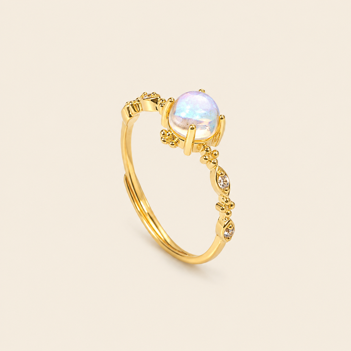 Soft Moon Ring with a pale blue round centre stone and small floral accents in gold finish