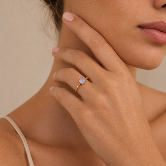 Soft Moon Ring worn on the hand in gold finish