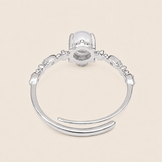 Soft Moon Ring with a pale blue round centre stone and small floral accents in silver finish