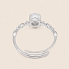 Soft Moon Ring with a pale blue round centre stone and small floral accents in silver finish
