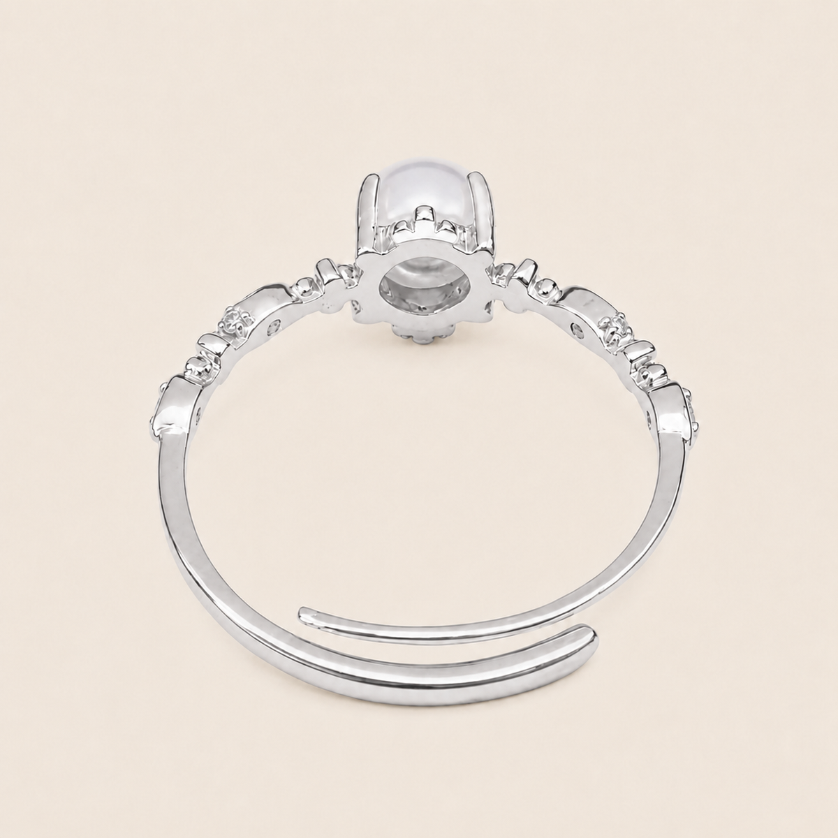 Soft Moon Ring with a pale blue round centre stone and small floral accents in silver finish