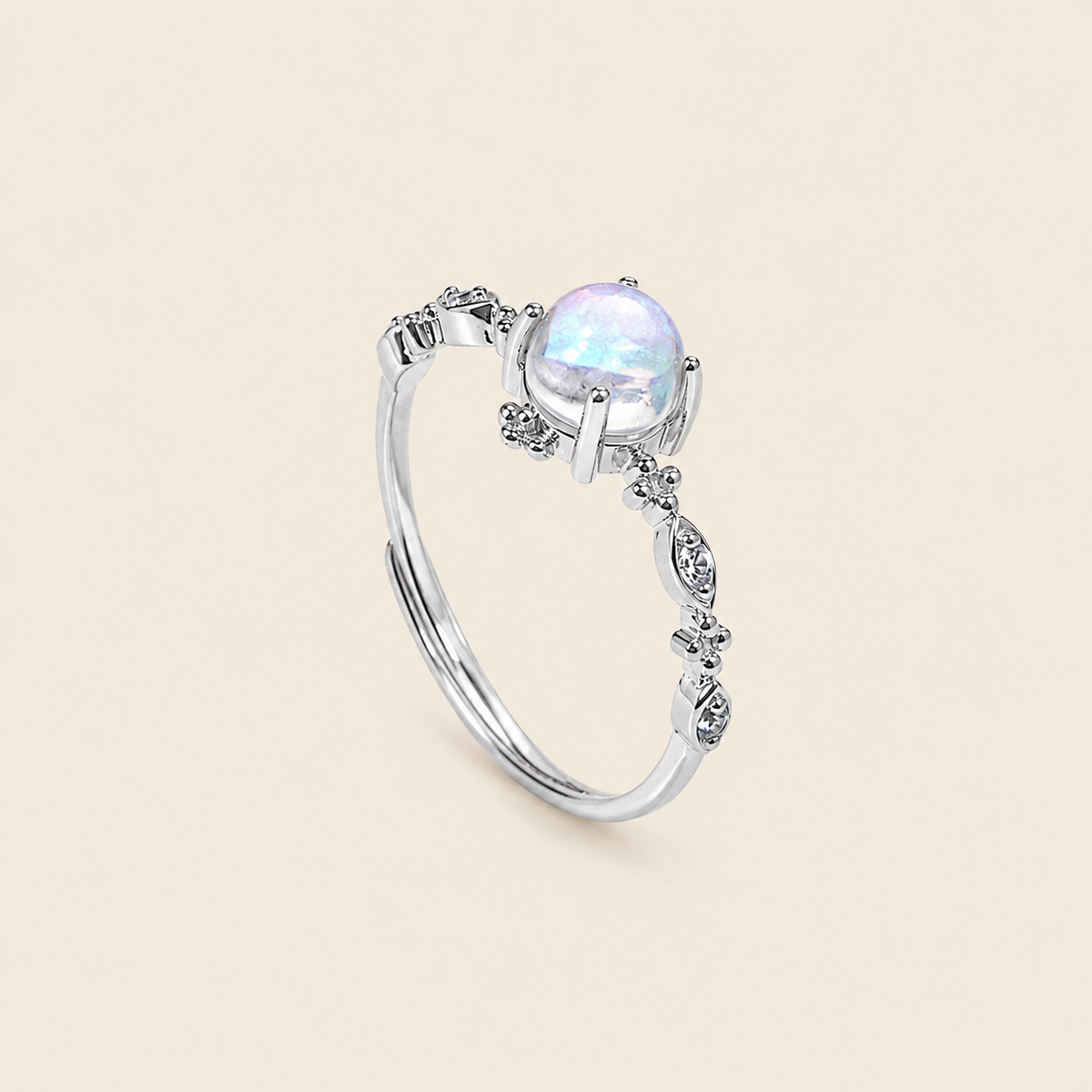 Soft Moon Ring with a pale blue round centre stone and small floral accents in silver finish