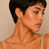 Soft Taper Earrings worn on the ear in gold finish