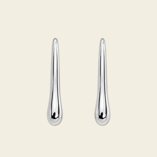 Soft Taper Earrings with slender tapered drops with rounded ends in silver finish