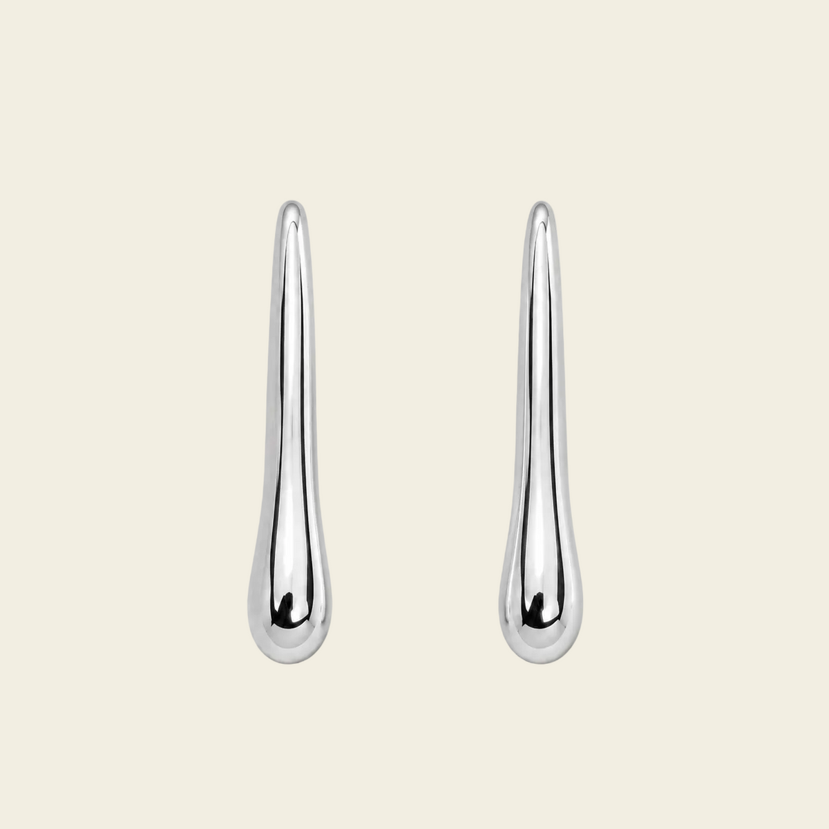 Soft Taper Earrings with slender tapered drops with rounded ends in silver finish