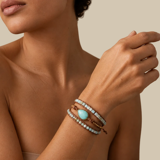 Solene Drift Bracelet worn on the wrist, with layered pale blue and cream beads with a pale oval centre