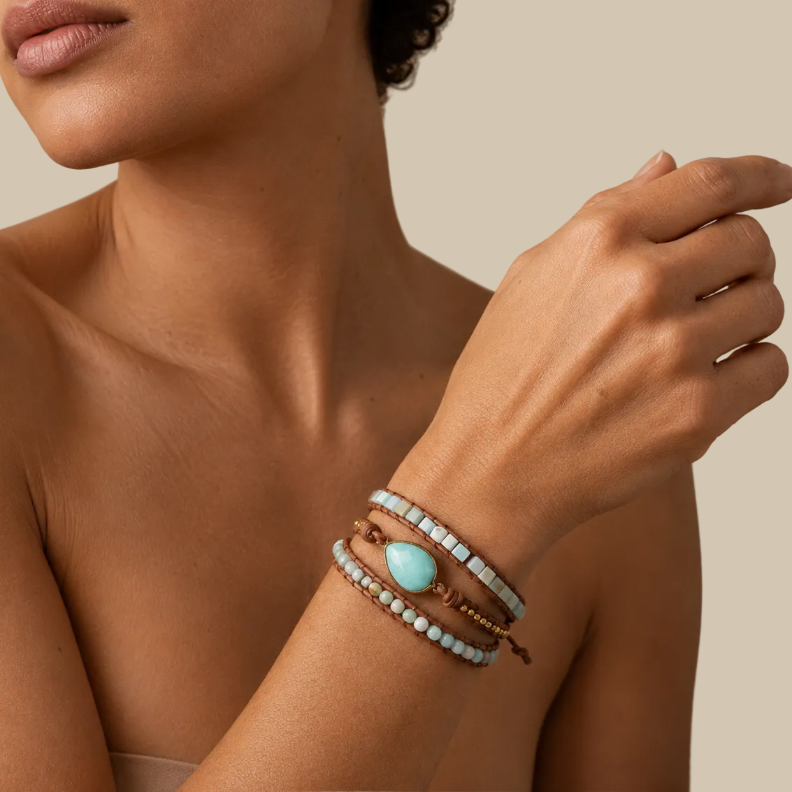 Solene Drift Bracelet worn on the wrist, with layered pale blue and cream beads with a pale oval centre