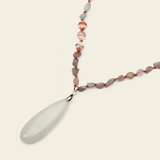 Stillwater Thread Necklace with pale beads and an elongated pale pendant
