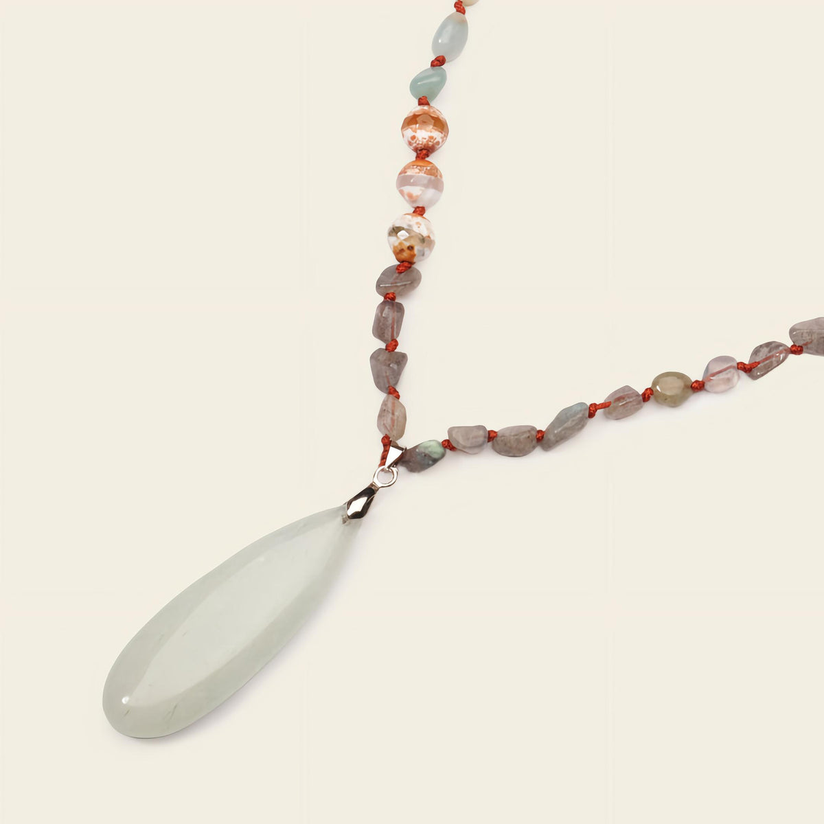 Stillwater Thread Necklace with pale beads and an elongated pale pendant